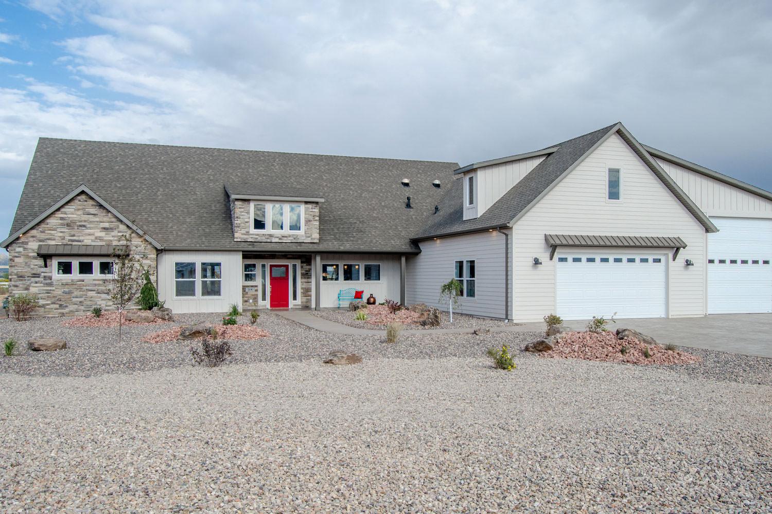 exterior front of the house with two garages on the right side