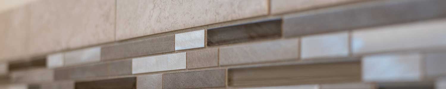 close up of brown and white tile pattern in shower of master bathroom