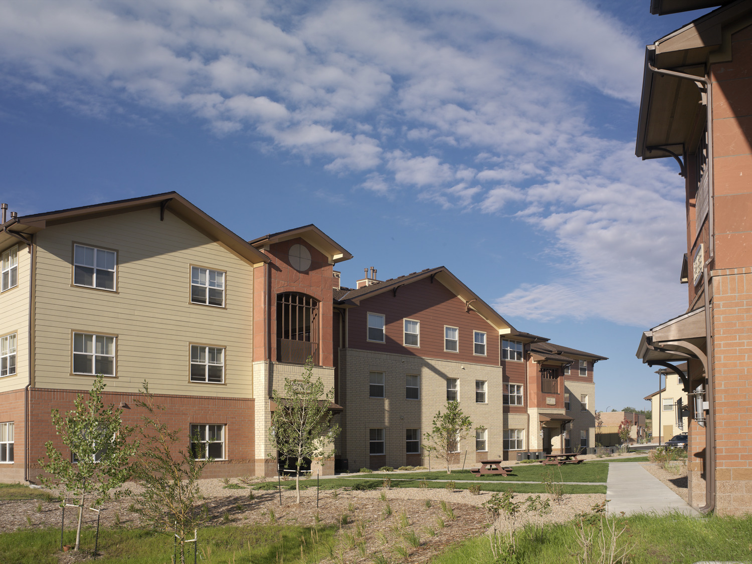 Student housing buildings at the Denver Seminary campus with multi‑story residential units and landscaped walkways.