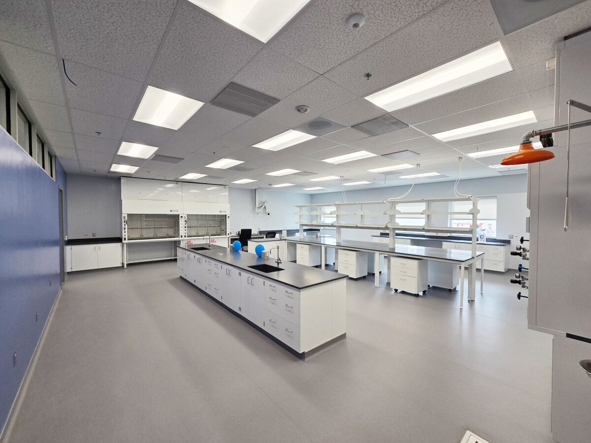 Toxicology laboratory at the Colorado Bureau of Investigation with lab benches, fume hoods, shelving, and integrated casework.