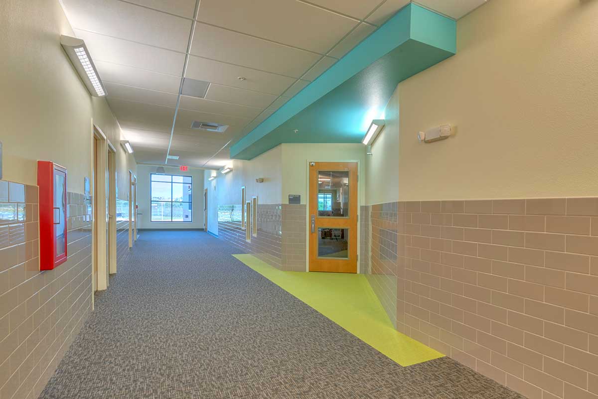 Design of corridors to aid in visibility and minimize hiding spaces helps the detection aspect of a response should a perpetrator enter the school.
