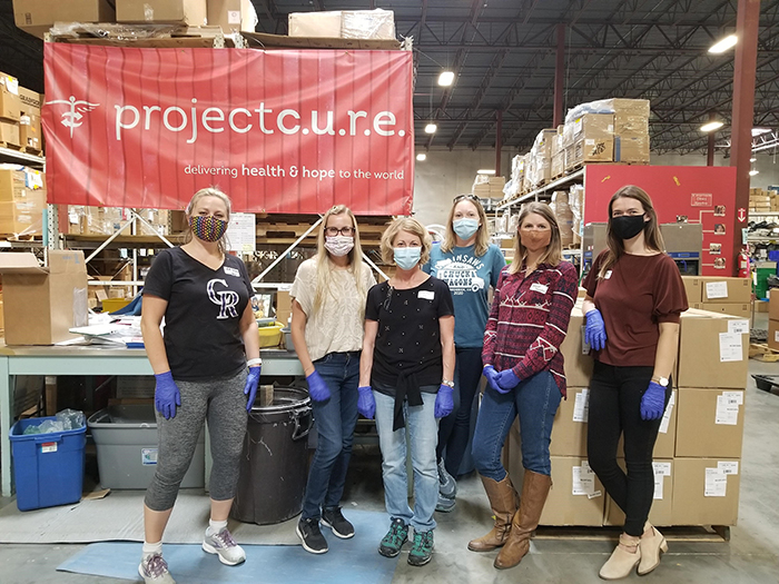 volunteers at project cure warehouse