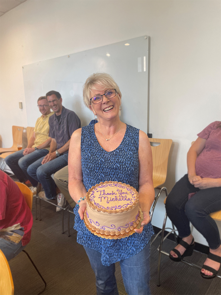 michelle holding a cake