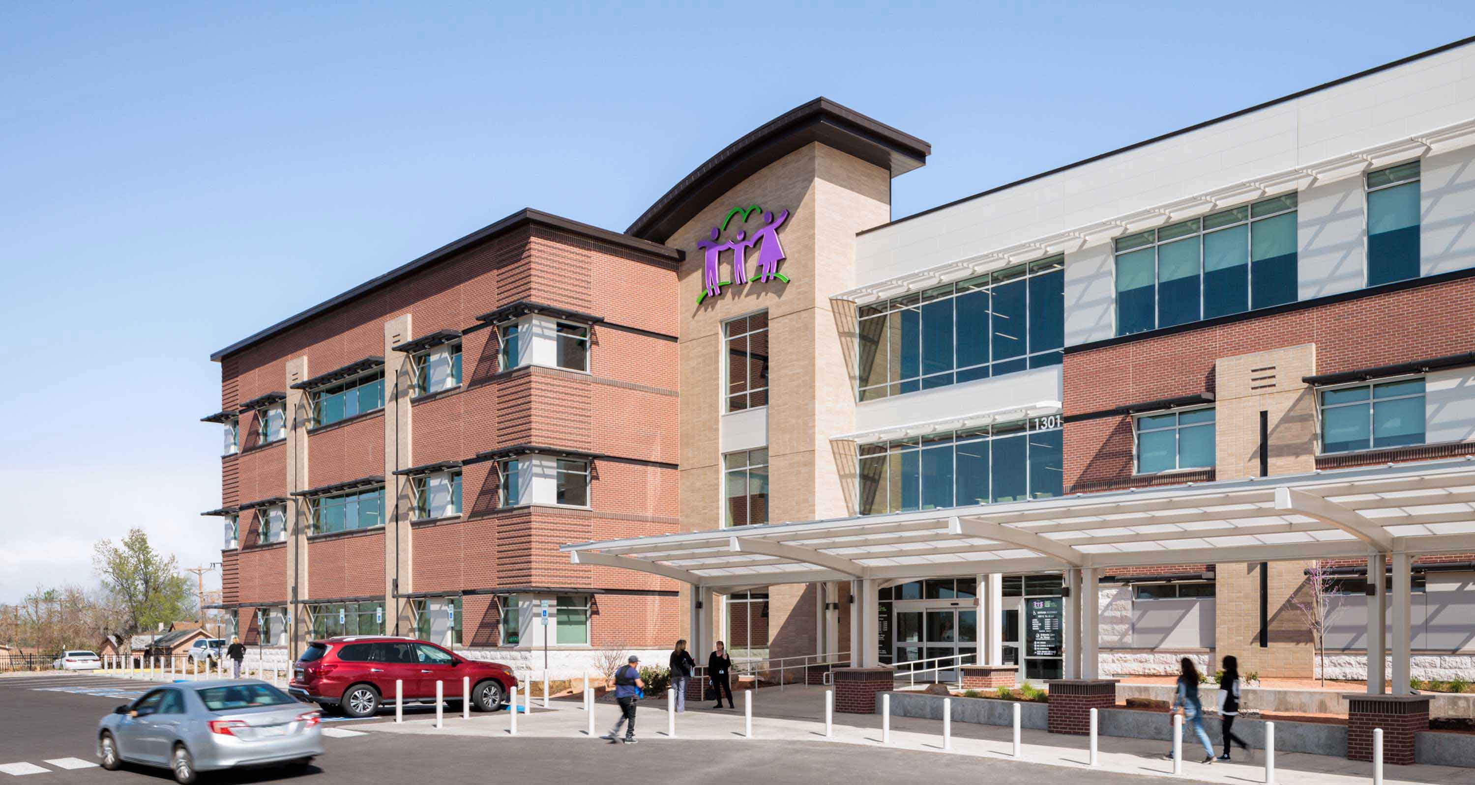 Exterior view of the PCHC East Side Clinic, showcasing its award-winning architectural design with modern lines, large windows, and a welcoming entrance.