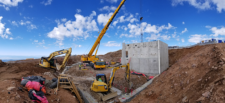 pre-cast concrete walls being erected atop the summit of pikes peak