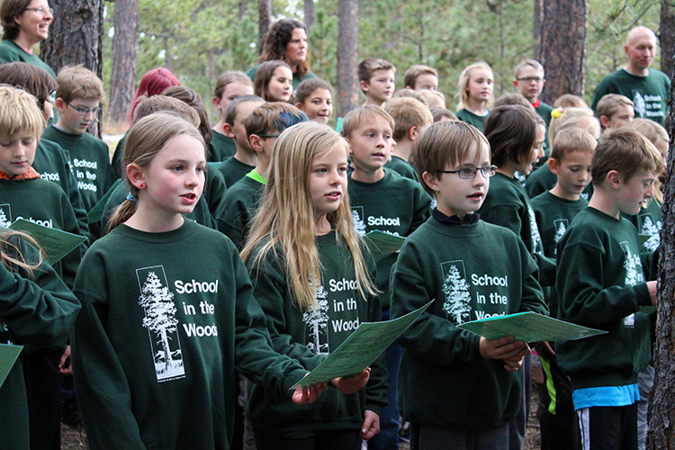 students in school in the woods sweatshirts at the ground breaking