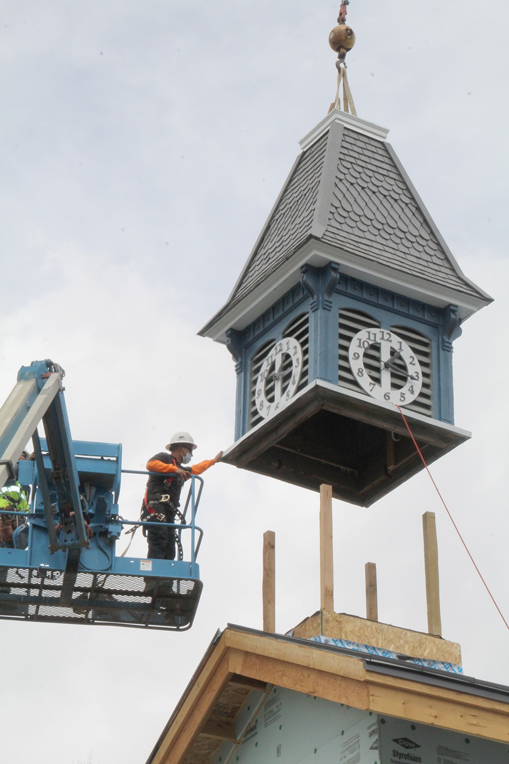 restored cupola being lowered into place